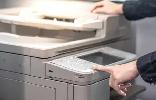 A woman scanning a document to send to Dygitize Store